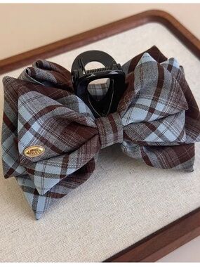 fabric bow hair claw clip featuring a plaid pattern blue/brown